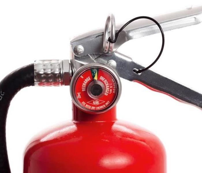 Firing mechanism on a red fire extinguisher 